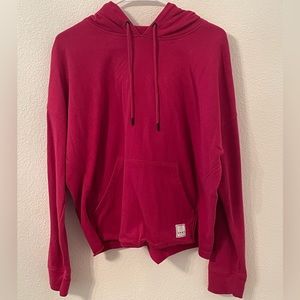 This is a bright maroon, slightly cropped hoodie